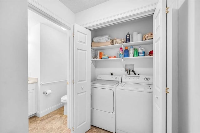 laundry room featuring separate washer and dryer