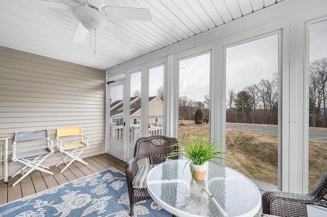 sunroom / solarium with ceiling fan