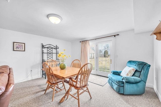 dining space with carpet floors