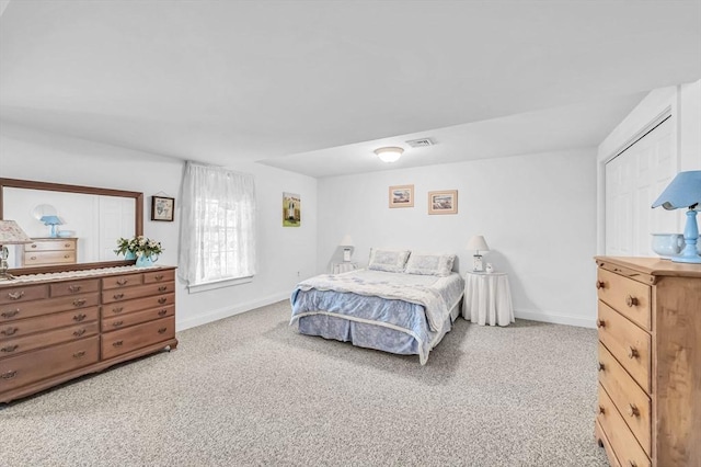 bedroom with light colored carpet