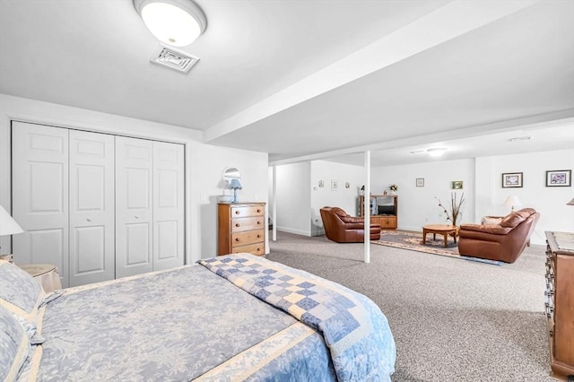 bedroom with carpet flooring and a closet