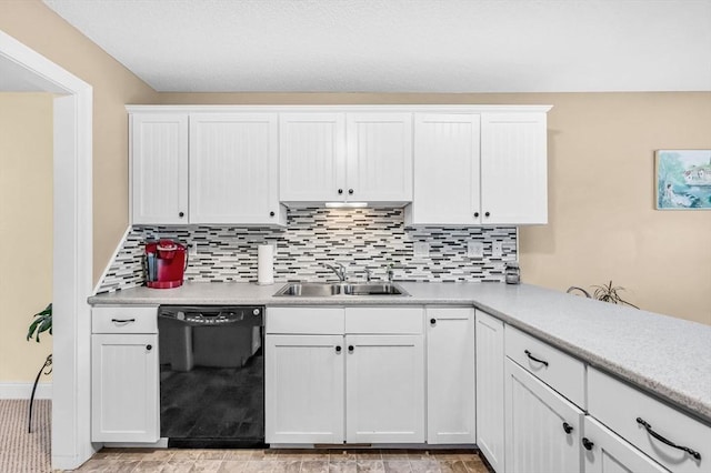 kitchen featuring dishwasher, white cabinets, and sink