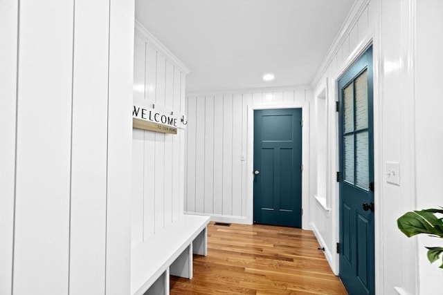 mudroom with light wood-style floors