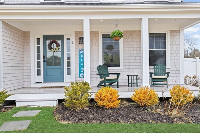 entrance to property featuring a porch