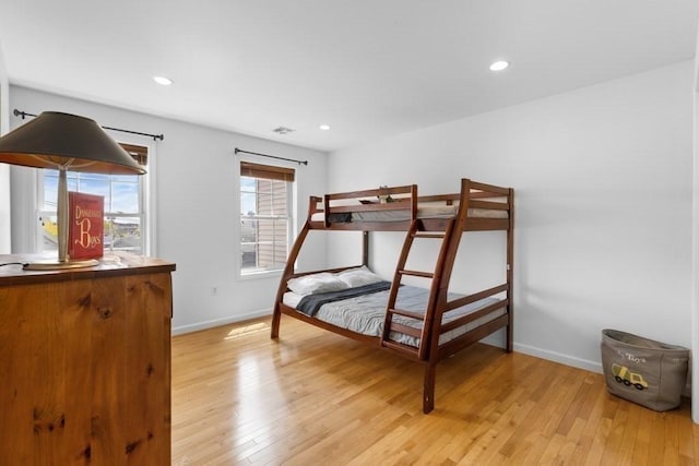 bedroom featuring recessed lighting, baseboards, visible vents, and light wood-type flooring