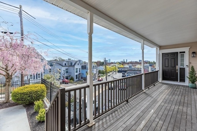 wooden terrace with a residential view