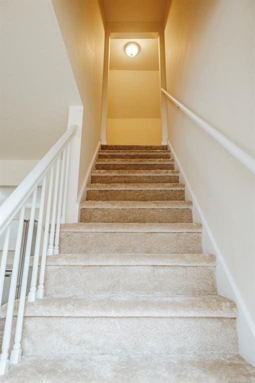 staircase with baseboards