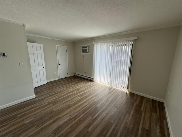 1186 Worcester Rd Unit 231, Framingham, MA 01702 - spare room with a baseboard radiator, dark wood-style floors, a textured ceiling, baseboards, and ornamental molding