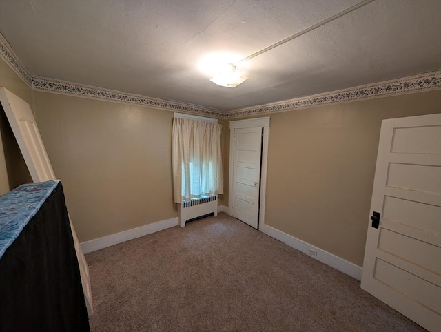 5 Hall St, Webster, MA 01570 - unfurnished bedroom featuring radiator, light carpet, and baseboards