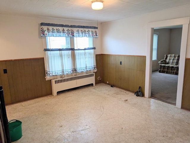 5 Hall St, Webster, MA 01570 - empty room with radiator, a wainscoted wall, wooden walls, and ornamental molding