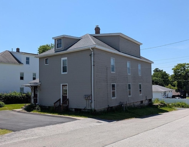 5 Hall St, Webster, MA 01570 - view of side of home with entry steps, a chimney, and a shingled roof