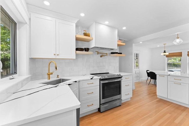 633 Lagrange St, Boston, MA 02132 - kitchen with stainless steel electric range, open shelves, a sink, plenty of natural light, and recessed lighting