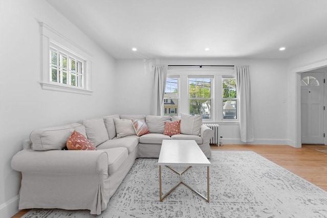 633 Lagrange St, Boston, MA 02132 - living room featuring radiator heating unit, wood finished floors, recessed lighting, and baseboards