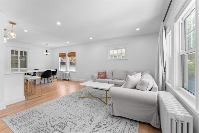 633 Lagrange St, Boston, MA 02132 - living area with radiator, wood finished floors, recessed lighting, and baseboards