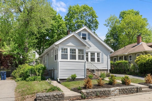 633 Lagrange St, Boston, MA 02132 - bungalow-style home with fence and a chimney
