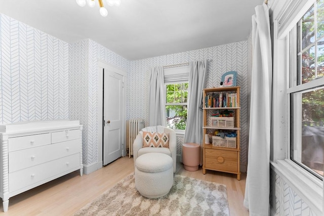 633 Lagrange St, Boston, MA 02132 - living area featuring wallpapered walls and light wood finished floors