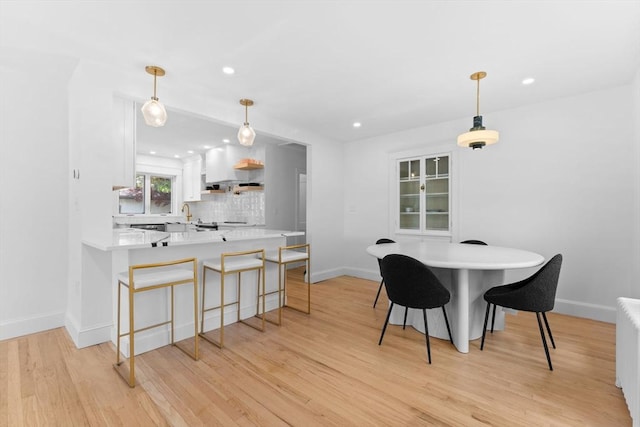 633 Lagrange St, Boston, MA 02132 - dining space with light wood-type flooring, baseboards, and recessed lighting