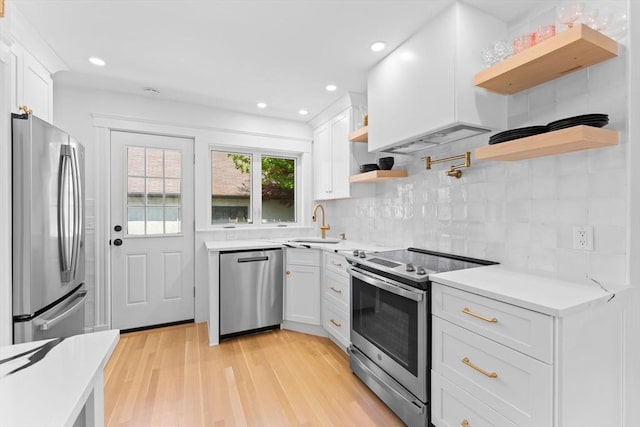 633 Lagrange St, Boston, MA 02132 - kitchen featuring open shelves, stainless steel appliances, light countertops, white cabinets, and recessed lighting