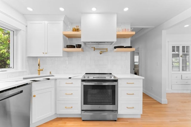 633 Lagrange St, Boston, MA 02132 - kitchen featuring open shelves, stainless steel appliances, light countertops, light wood-type flooring, and recessed lighting