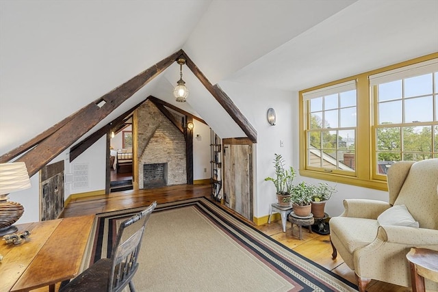 6 Lee St, Marblehead, MA 01945 - additional living space with wood finished floors, a stone fireplace, lofted ceiling, and baseboards