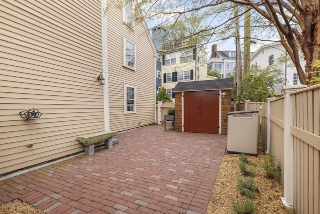 6 Lee St, Marblehead, MA 01945 - view of patio / terrace with a storage unit, an outbuilding, fence, and a residential view
