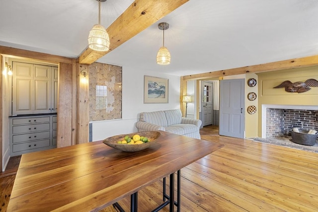 6 Lee St, Marblehead, MA 01945 - dining space with hardwood / wood-style flooring, beam ceiling, and a brick fireplace