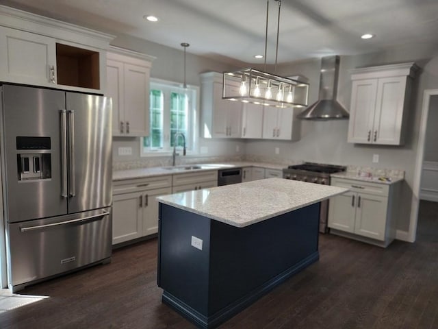 138 Elm St, Uxbridge, MA 01569 - kitchen featuring high end refrigerator, range, wall chimney exhaust hood, a center island, and white cabinetry