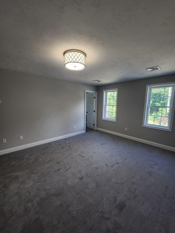 138 Elm St, Uxbridge, MA 01569 - empty room featuring baseboards and dark carpet