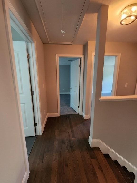 138 Elm St, Uxbridge, MA 01569 - corridor with attic access, dark wood-style flooring, and baseboards