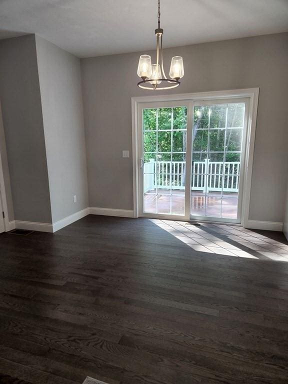 138 Elm St, Uxbridge, MA 01569 - unfurnished dining area featuring plenty of natural light, a chandelier, and baseboards