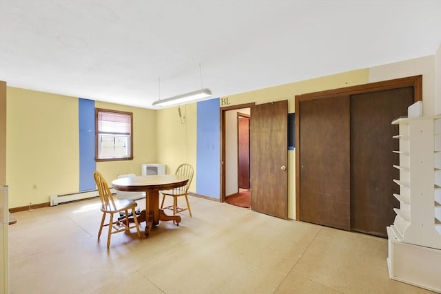dining area featuring a baseboard radiator and baseboards