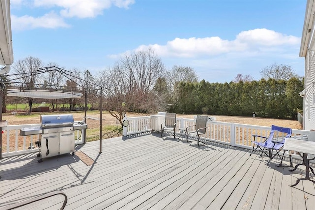 deck featuring grilling area and a gazebo