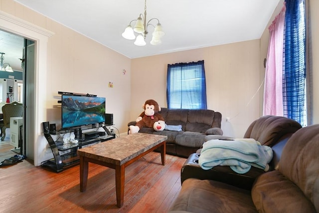 living room featuring a chandelier and hardwood / wood-style floors