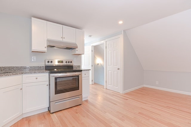 kitchen with light hardwood / wood-style floors, light stone counters, vaulted ceiling, white cabinets, and electric range