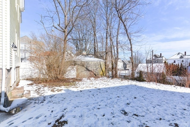 view of yard layered in snow