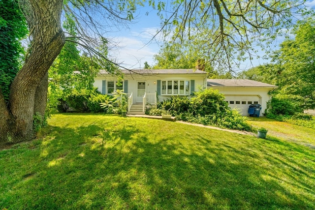 single story home featuring a garage and a front yard