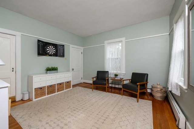136 Walnut St, Braintree, MA 02184 - living area with baseboard heating and wood finished floors