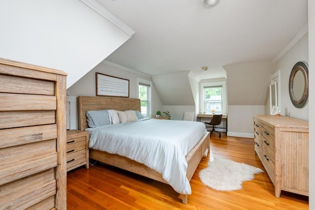 136 Walnut St, Braintree, MA 02184 - bedroom with wood finished floors, ornamental molding, and vaulted ceiling