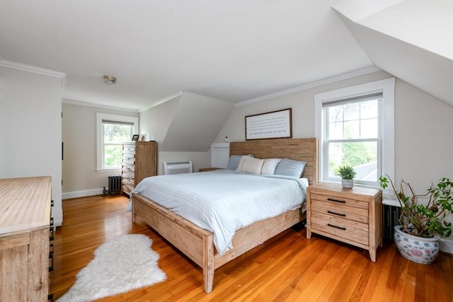 136 Walnut St, Braintree, MA 02184 - bedroom featuring radiator, light wood-type flooring, vaulted ceiling, and crown molding