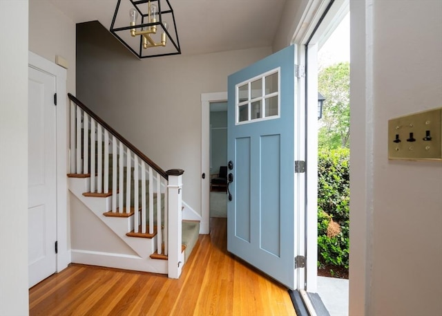 136 Walnut St, Braintree, MA 02184 - entryway featuring a chandelier, wood finished floors, and stairway