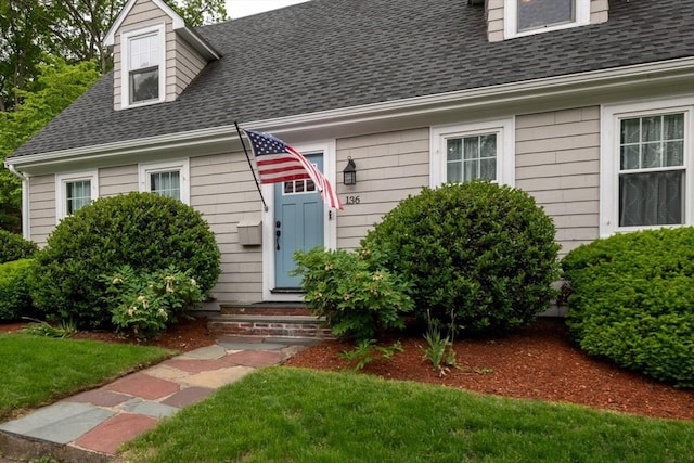 136 Walnut St, Braintree, MA 02184 - view of front of house featuring a shingled roof, entry steps, and a front lawn