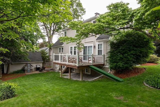 136 Walnut St, Braintree, MA 02184 - back of house featuring stairway, a wooden deck, a lawn, and an outdoor structure