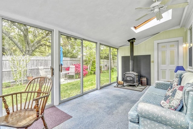 7 Burton Ave, Harwich, MA 02671 - sunroom featuring a skylight, a wood stove, and lofted ceiling