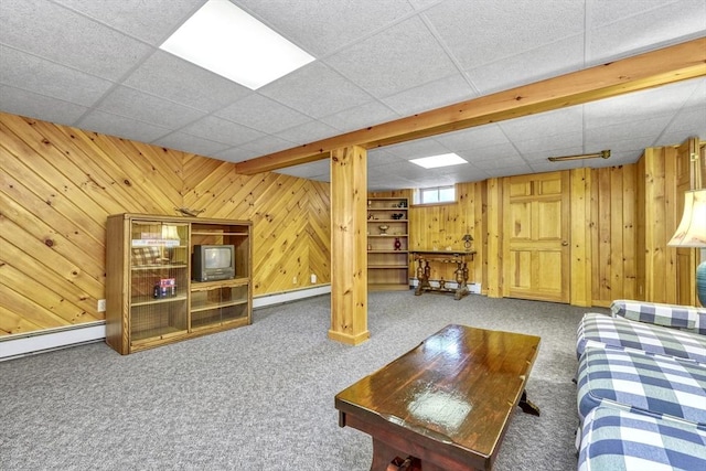 7 Burton Ave, Harwich, MA 02671 - living room with a baseboard radiator, carpet, wooden walls, and a paneled ceiling