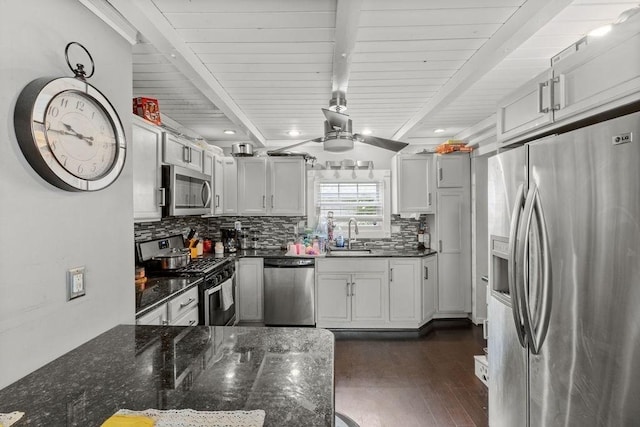 274 Primrose, Fall River, MA 02720 - kitchen featuring appliances with stainless steel finishes, backsplash, dark wood-style floors, dark stone counters, and ceiling fan