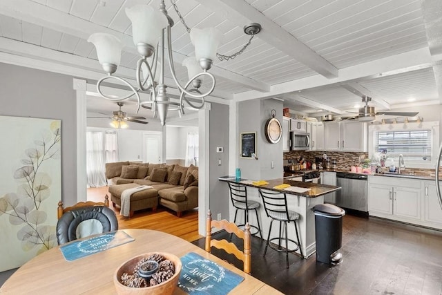 274 Primrose, Fall River, MA 02720 - dining space featuring dark wood-style floors, healthy amount of natural light, a ceiling fan, and a wooden ceiling with exposed beams
