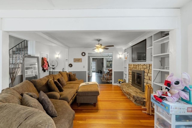274 Primrose, Fall River, MA 02720 - living room featuring light wood-style flooring, a ceiling fan, and a stone fireplace