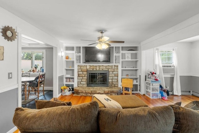 274 Primrose, Fall River, MA 02720 - living room featuring ceiling fan, wood finished floors, a stone fireplace, and built in features