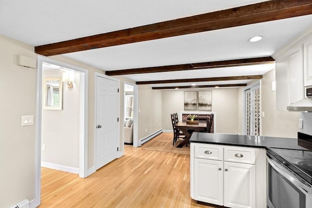 kitchen featuring white cabinets, light wood-style floors, baseboard heating, stainless steel electric stove, and beamed ceiling