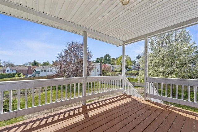wooden terrace with a residential view